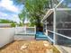 Enjoy the deck overlooking the backyard and screened-in pool at 10206 N Hyaleah Rd, Tampa, FL 33617
