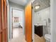Decorated half-bath with tile ceiling, stylish mirror, and access to the main bedroom at 10206 N Hyaleah Rd, Tampa, FL 33617