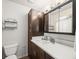 Bathroom with a vanity, storage cabinet, and vanity mirror at 10206 N Hyaleah Rd, Tampa, FL 33617