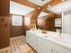 Bathroom featuring double sink vanity, a large mirror, and neutral decor at 10206 N Hyaleah Rd, Tampa, FL 33617