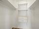 A walk-in closet featuring built-in shelves and drawers for efficient storage solutions at 10206 N Hyaleah Rd, Tampa, FL 33617