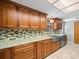 Modern kitchen with sleek stainless steel appliances and stone countertops at 10206 N Hyaleah Rd, Tampa, FL 33617