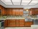 Updated kitchen with stainless steel appliances and custom cabinetry at 10206 N Hyaleah Rd, Tampa, FL 33617
