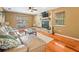 Inviting living room with a stone fireplace and comfortable leather sofa at 10206 N Hyaleah Rd, Tampa, FL 33617