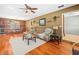 Cozy living room with hardwood floors and custom built-ins, perfect for relaxing at 10206 N Hyaleah Rd, Tampa, FL 33617