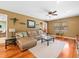 Comfortable living room with hardwood floors and ample natural light, perfect for gatherings at 10206 N Hyaleah Rd, Tampa, FL 33617