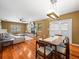 Open concept layout showcasing living and dining areas with a fireplace at 10206 N Hyaleah Rd, Tampa, FL 33617