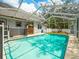 Relax by the screened-in pool with a convenient storage shed in the backyard at 10206 N Hyaleah Rd, Tampa, FL 33617