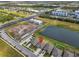 Aerial view showcases the property's location relative to the highway and commercial buildings in the area at 10433 Alder Green Dr, Riverview, FL 33578