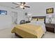 Bedroom with tile floor, ceiling fan, and ensuite bathroom featuring a shower at 10433 Alder Green Dr, Riverview, FL 33578