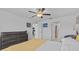 Bedroom featuring an ensuite bathroom, kitchen and ceiling fan at 10433 Alder Green Dr, Riverview, FL 33578