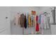 Walk-in closet with hanging clothes and a wire shelving system at 10433 Alder Green Dr, Riverview, FL 33578
