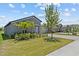 Well-maintained lawn and landscaping in front of a single-story home with a two-car garage at 10433 Alder Green Dr, Riverview, FL 33578