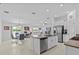 Open concept kitchen featuring stainless steel appliances, granite counters, and an island at 10433 Alder Green Dr, Riverview, FL 33578