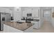 Kitchen with stainless steel appliances, white cabinets, and granite countertops at 10433 Alder Green Dr, Riverview, FL 33578