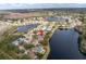 An aerial view of the community highlighting the home's scenic lakeside location with natural surroundings at 10506 Sky Flower Ct, Land O Lakes, FL 34638