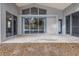 View of back patio with sliding glass doors, providing an ideal transition between indoor and outdoor living spaces at 10506 Sky Flower Ct, Land O Lakes, FL 34638