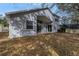 Rear exterior of home with large windows and doors to backyard, perfect for outdoor living and entertaining at 10506 Sky Flower Ct, Land O Lakes, FL 34638