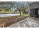 Expansive backyard showing a waterfront view with trees, perfect for enjoying the natural scenery at 10506 Sky Flower Ct, Land O Lakes, FL 34638
