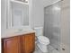 Bathroom featuring a glass-enclosed shower, wooden vanity, and modern fixtures at 10506 Sky Flower Ct, Land O Lakes, FL 34638