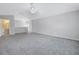 Expansive bonus room with plush carpeting and access to the ensuite bathroom at 10506 Sky Flower Ct, Land O Lakes, FL 34638