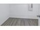 White closet with laminate flooring and white wire rack shelving at 10506 Sky Flower Ct, Land O Lakes, FL 34638