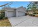 Spacious two-car garage offering ample parking with an extended driveway and easy access at 10506 Sky Flower Ct, Land O Lakes, FL 34638