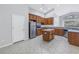 Bright kitchen with ample cabinet space, modern appliances, a functional island, and a view of the backyard at 10506 Sky Flower Ct, Land O Lakes, FL 34638