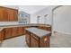 Well-equipped kitchen featuring stainless steel appliances, granite countertops, an island, and ample cabinet space at 10506 Sky Flower Ct, Land O Lakes, FL 34638