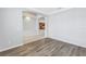 Open living area with vinyl plank flooring leading to the eat-in kitchen at 10506 Sky Flower Ct, Land O Lakes, FL 34638