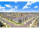An aerial view of a home nestled in a well-planned community, with lush landscaping at 10998 Gable Dig Loop, San Antonio, FL 33576