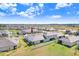 An aerial view showcasing the home, backyard, and well-maintained landscaping at 10998 Gable Dig Loop, San Antonio, FL 33576