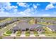An aerial view showcasing a home and its proximity to a beautiful pond at 10998 Gable Dig Loop, San Antonio, FL 33576