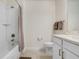 Bathroom with shower-tub combo, single vanity with modern fixtures, and neutral color scheme at 10998 Gable Dig Loop, San Antonio, FL 33576