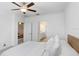 Bedroom with neutral colors and ensuite bathroom at 10998 Gable Dig Loop, San Antonio, FL 33576