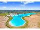 Picturesque aerial view of large community pool with bars, beaches, and other activities at 10998 Gable Dig Loop, San Antonio, FL 33576