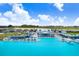 A large community pool with a beach, clubhouse, and lots of lounge seating at 10998 Gable Dig Loop, San Antonio, FL 33576