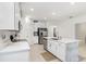 Bright kitchen featuring a center island with a stainless steel refrigerator at 10998 Gable Dig Loop, San Antonio, FL 33576