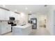 Bright kitchen featuring a center island with a stainless steel refrigerator at 10998 Gable Dig Loop, San Antonio, FL 33576
