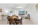 Bright and airy living room with modern furnishings and sliding glass doors to outdoor space at 10998 Gable Dig Loop, San Antonio, FL 33576