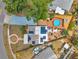 Aerial view of the property showcasing the pool, solar panels, and landscaping at 1111 32Nd N St, St Petersburg, FL 33713