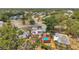 Aerial view of the property showcasing a pool with attached patio and solar panels at 1111 32Nd N St, St Petersburg, FL 33713