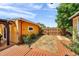 Backyard with wooden deck and path to wooden fence at 1111 32Nd N St, St Petersburg, FL 33713