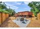 This backyard has a cozy seating area and a partial above ground pool deck with steps at 1111 32Nd N St, St Petersburg, FL 33713