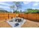 Inviting backyard features a cozy seating area with modern chairs and a wooden fence at 1111 32Nd N St, St Petersburg, FL 33713