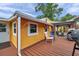 Exterior view of home with a back patio, grill, and outdoor seating, perfect for entertaining at 1111 32Nd N St, St Petersburg, FL 33713