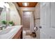 Charming bathroom features tile floors, vanity, wood ceiling and a tiled shower and classic design at 1111 32Nd N St, St Petersburg, FL 33713
