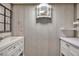 Bright bathroom with white walls, vanity, lighting, and stylish sink at 1111 32Nd N St, St Petersburg, FL 33713