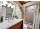 The bathroom features a marble vanity, tiled shower, and wood ceiling offering a blend of functionality and style at 1111 32Nd N St, St Petersburg, FL 33713