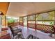 Charming front porch with wicker furniture, decorative lattice, and inviting ambiance at 1111 32Nd N St, St Petersburg, FL 33713